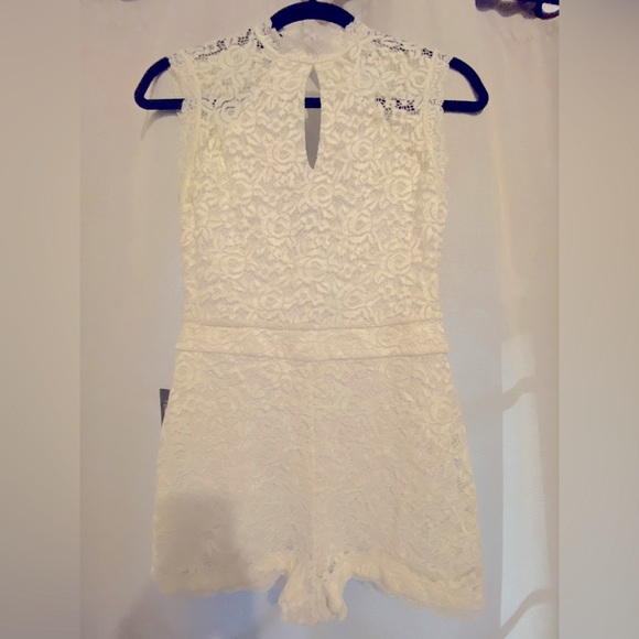 bebe Pants - Bebe woman’s white, lace, romper, size 4.
